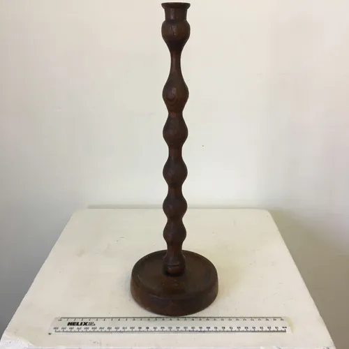 Tall dark wavy wood candlestick 
