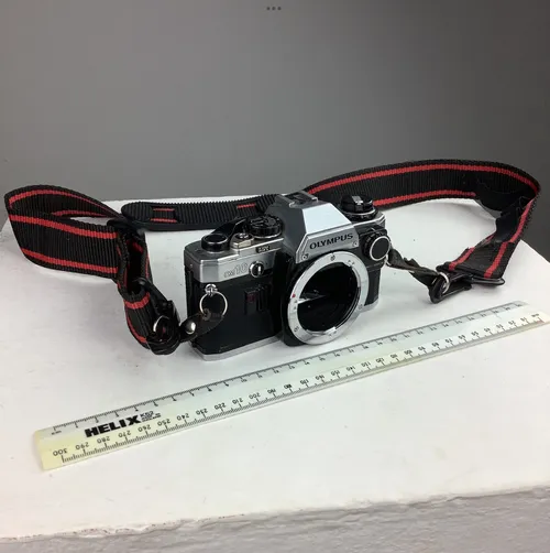 Olympus OM 10 Camera with Black and Red Strap