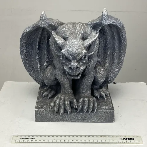Grey gargoyle sculptures On square base