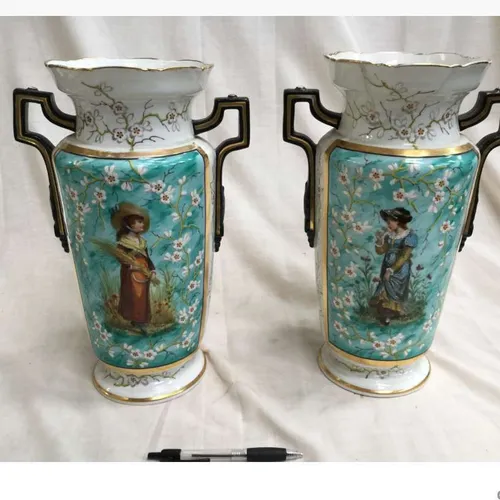 Pair of pale blue and white ceramic vases with two people and cherry blossom decoration and handles