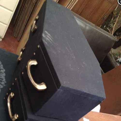 Half sized coffins, black fabric finish with gold handles