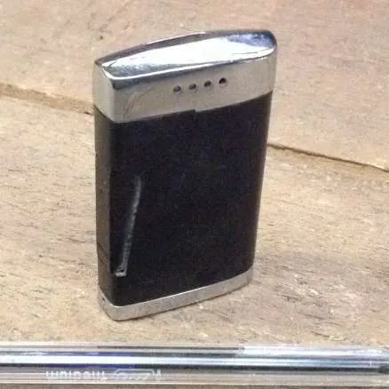 silver lighter with brown cover