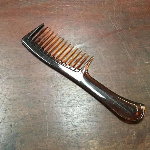 Brown Plastic Handle Comb