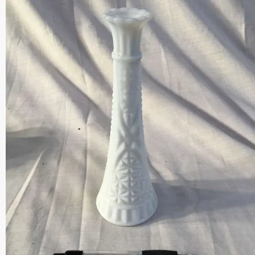 Small thin white vase with embossed details