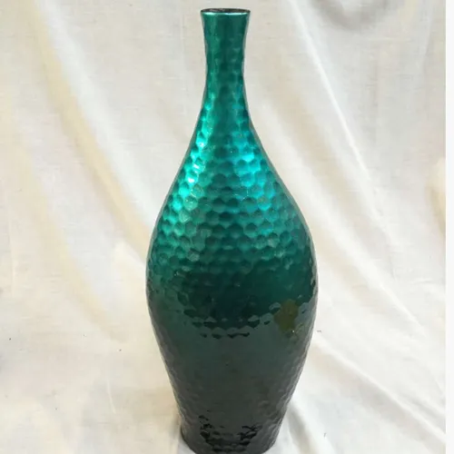 Shiny turquoise vase with honeycomb like effect