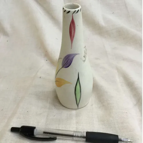 Small white ceramic vase ornament with coloured leaves design