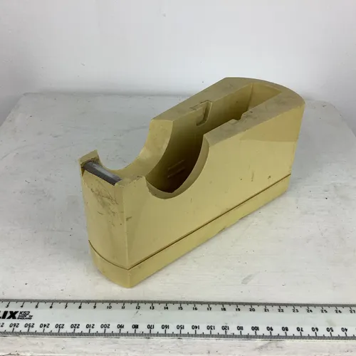 Beige plastic tape dispenser