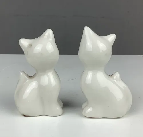 Twin White Ceramic Cars with Red Bow Tie