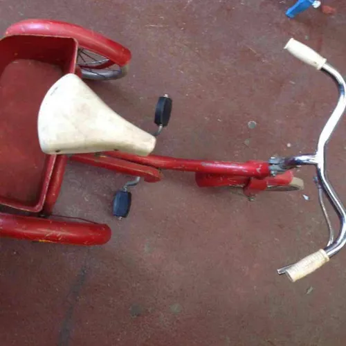 Red child tricycle 1960's
