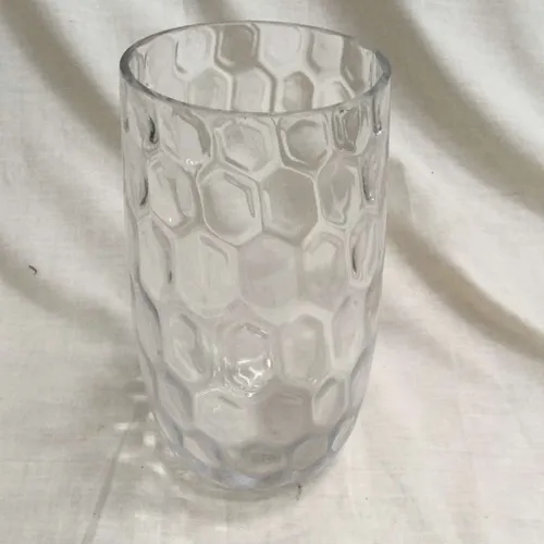 Tall clear glass divot vase
