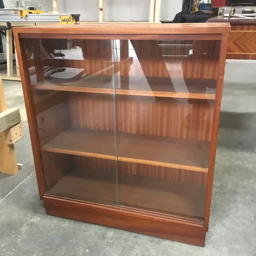 Wood cabinet with shelves sliding glass doors