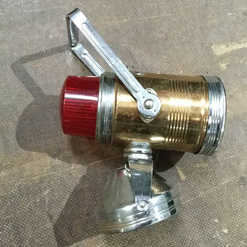 Tin lamp with red plastic end