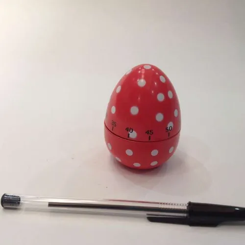 red, spotty egg-shaped kitchen timer
