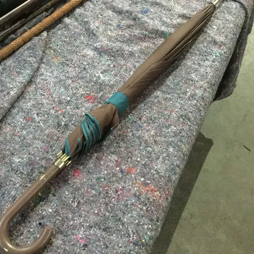 Brown umbrella with brown handle and blue trim