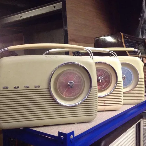 Period Bush radio in cream with silver speaker and dial detail