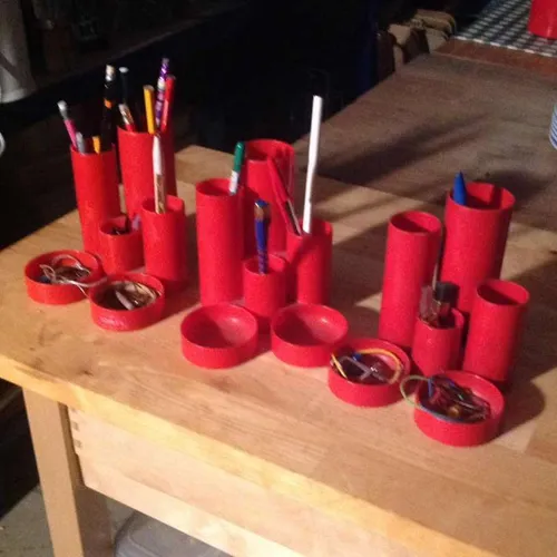 Red cylindrical stationary desk tidy