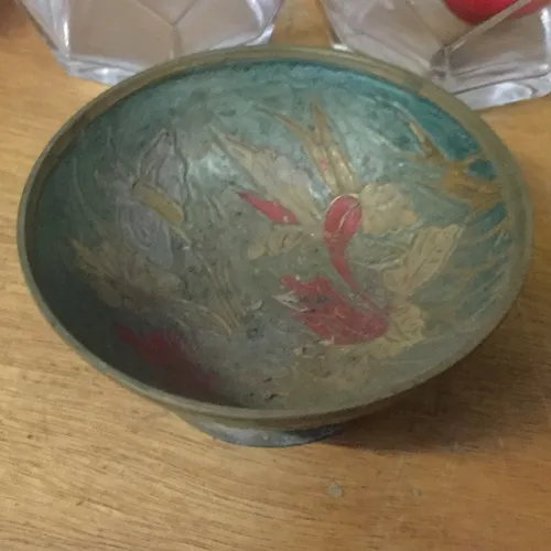 Small blue dish with floral/leaf design