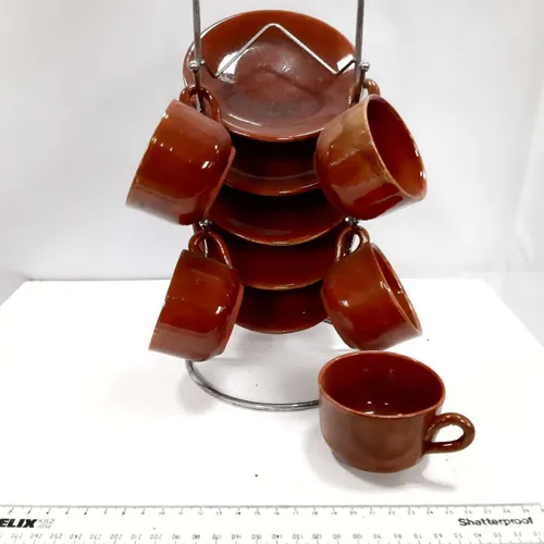 Brown glazed tea set with metal display rack
