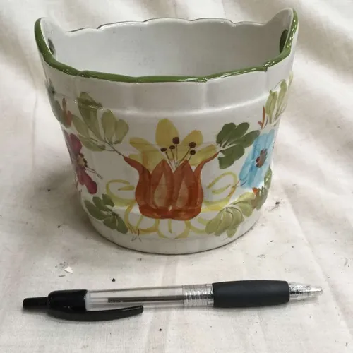 Ceramic planter with two handles and painted flower details 