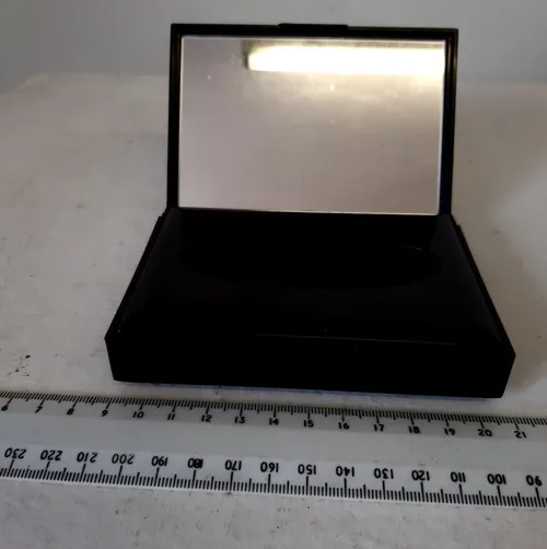 Small rectangular black plastic tissue box with pink floral design