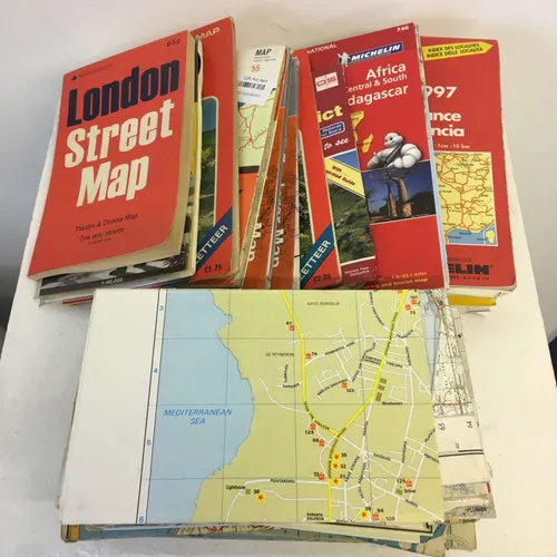 Various red street map books, individual ordinance survey plans and Michelin road maps
