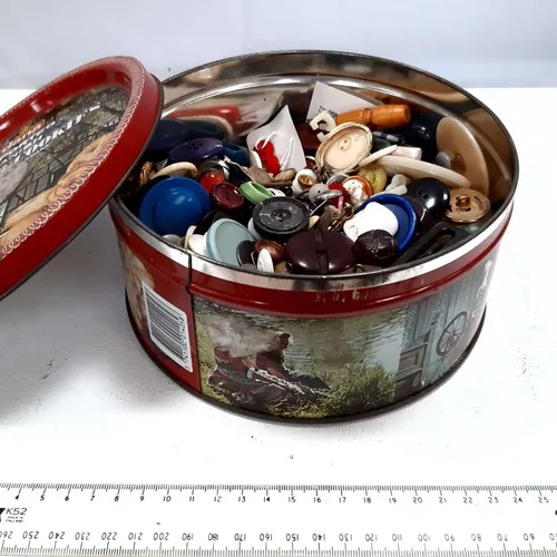 Biscuit tin full of buttons