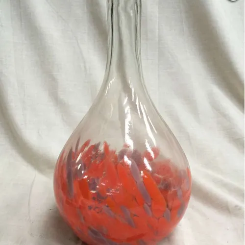 Clear glass vase with red/purple flecks on base