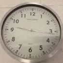 Stewart Superior analogue white face wall clock with silver metal rim