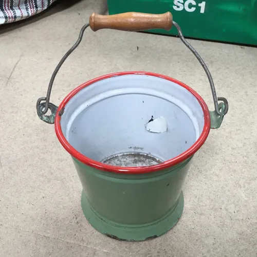 Green enamel bucket with red rim and wooden handle 
