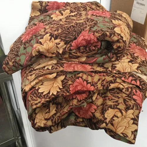 Thick brown curtains with green leaves and red/yellow flower design