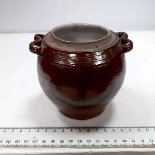 Dark brown glazed stoneware pot with handles