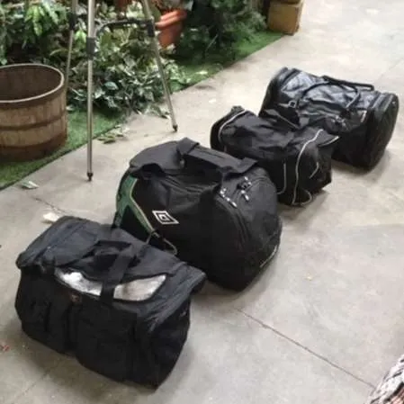 Various black sports hold-alls