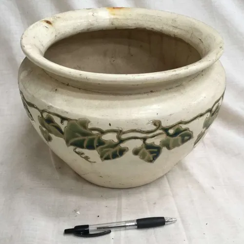 Cream plant pot with green vine detail 