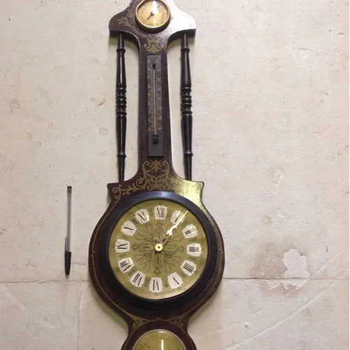 wooden analogue wall clock with plastic face and humidity, barometric pressure and temperature gauges