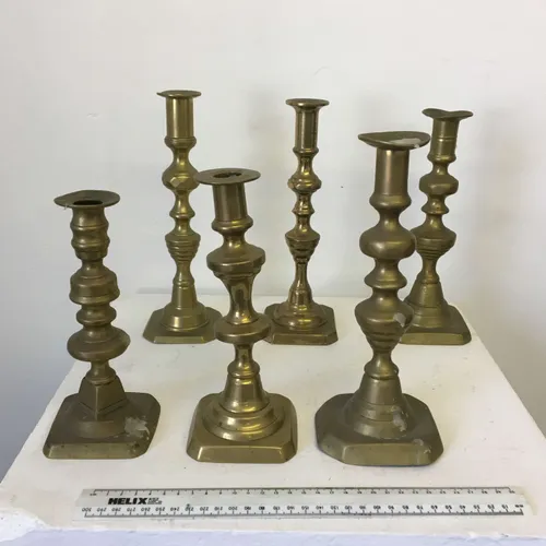 Various brass candlesticks