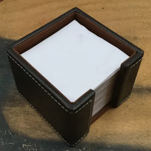 Brown leather notepaper holder and paper