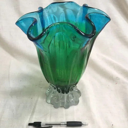 Tall green/blue glass vase with scalloped edge 