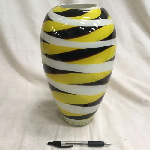 Yellow, black and white striped glass vase