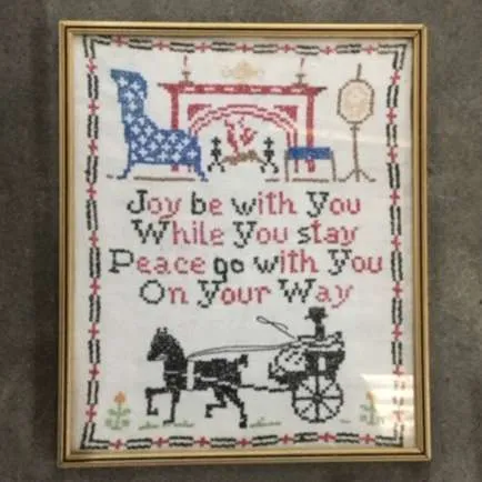 Cross stich image and message in gold frame