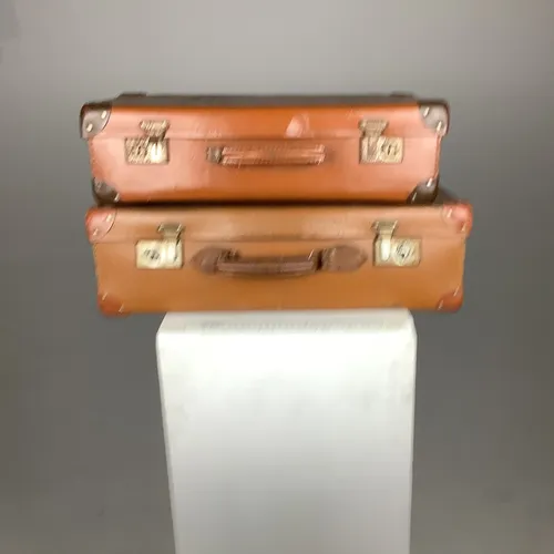 Various vintage light brown leather suitcases