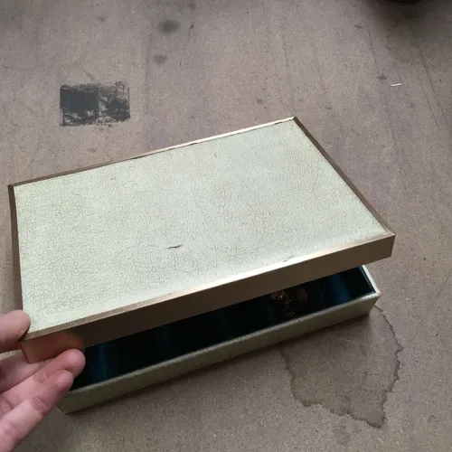 Cream and gold jewellery box with quantity of jewellery