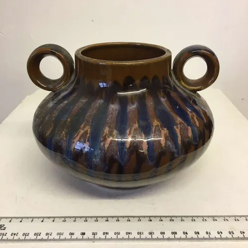 Brown and blue glazed ceramic pot with two handles