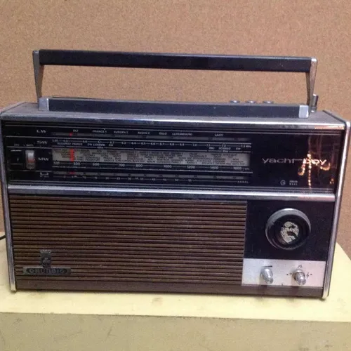 Period Grundig Yacht Boy portable radio unit in black / silver and wooden speaker panel