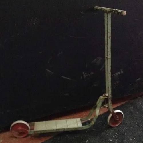 green metal childrens' scooter