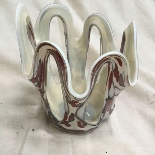 White and pink glass handkerchief style vase with holes