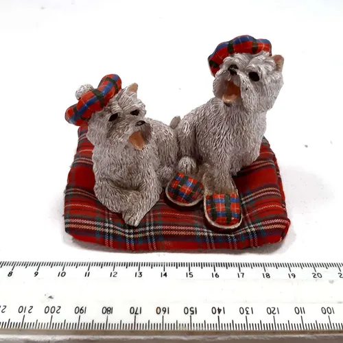 Dog wearing tartan hats and slippers on cotton bed ornament