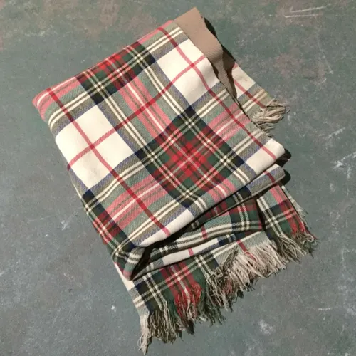 White, red and green tartan blanket