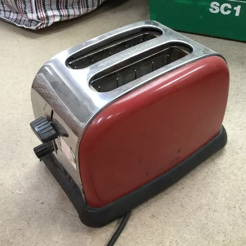 Red and silver metal toaster 