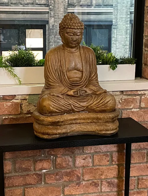 sitting buddha stone painted