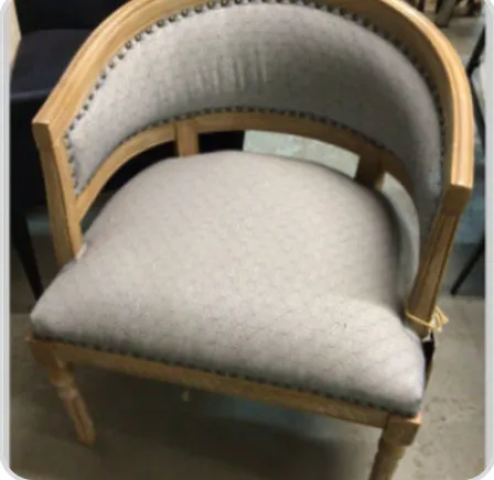 grey upholstered wood frame chair curved back 